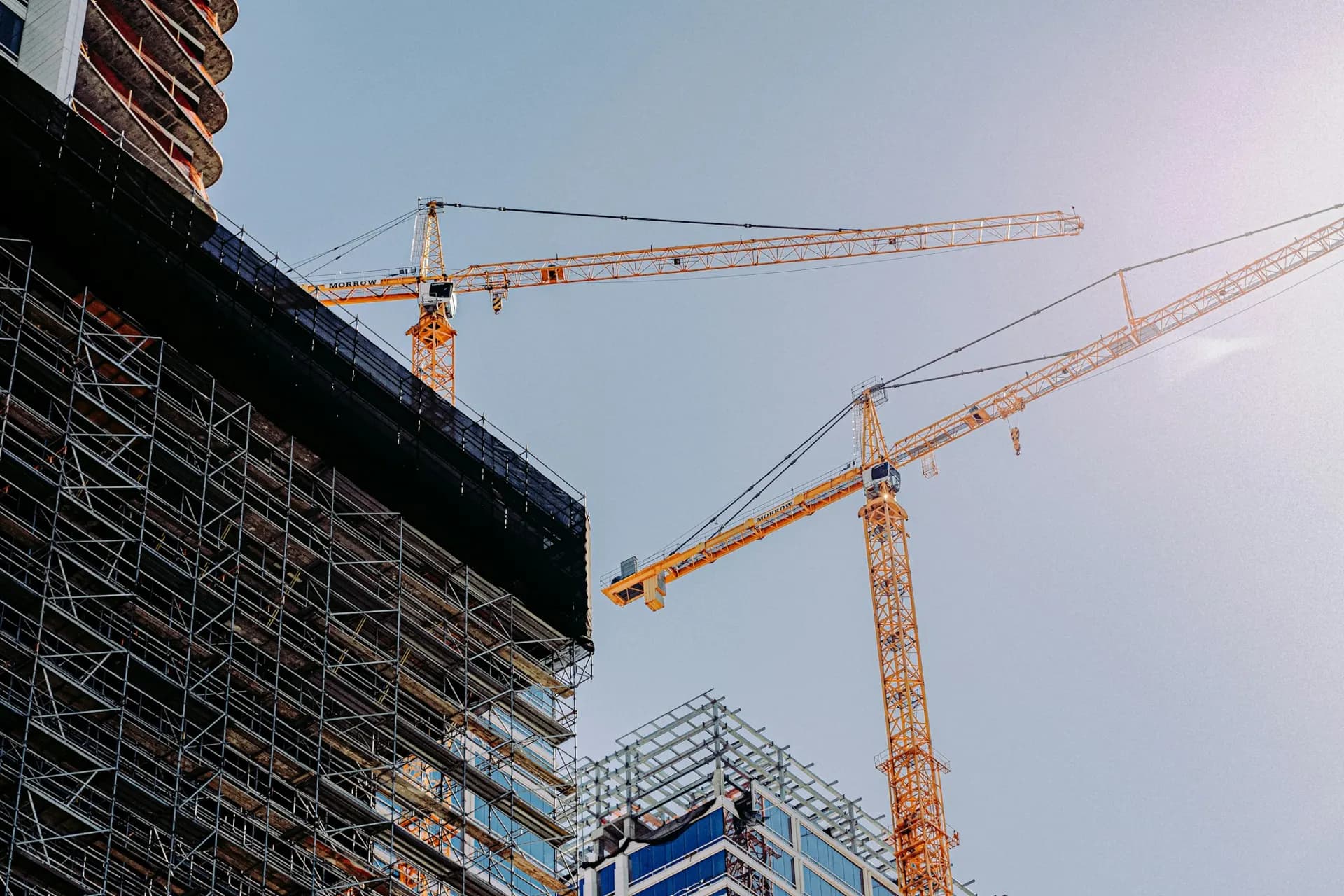 Tower cranes above a building under construction